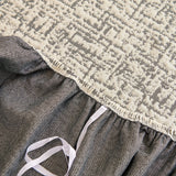 Stone Grey Jacquard sofa cover covering the arm and seat of a sectional, view 3