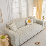 Stone Grey Jacquard sofa cover photographed at an angle beside a floor lamp