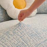 Stormy Blue Jacquard sofa cover shown across the seat and backrest of a two-seater