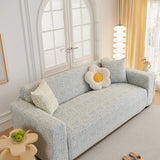 Stormy Blue Jacquard sofa cover covering the arm and seat of a sectional