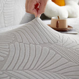 Pearl Grey Palm Relief sofa cover styled with cushions on a low-back sofa, view 2