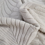 Pearl Grey Palm Relief sofa cover covering the arm and seat of a sectional, view 2