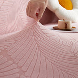 Pink Palm Relief sofa cover styled with cushions on a low-back sofa, view 3
