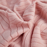 Pink Palm Relief sofa cover covering the arm and seat of a sectional, view 3