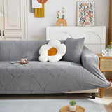 Stone Grey Palm Relief sofa cover shown across the seat and backrest of a two-seater, view 4