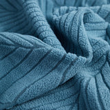 Stormy Blue Palm Relief sofa cover covering the arm and seat of a sectional