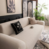 Ivory Cream Pinstripe Knit sofa cover seen from the side on a corner sofa