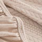 Ivory Cream Pinstripe Knit sofa cover covering the arm and seat of a sectional