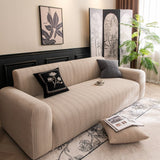 Khaki Pinstripe Knit sofa cover draped over a three-seater sofa in a bright living room, view 2