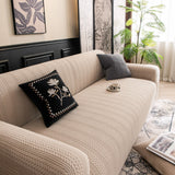 Khaki Pinstripe Knit sofa cover seen from the side on a corner sofa, view 2