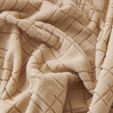 Boucle-Style Sand Quilted Waffle sofa cover styled with cushions on a low-back sofa, view 5