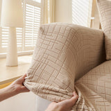 Boucle-Style Sand Quilted Waffle sofa cover covering the arm and seat of a sectional