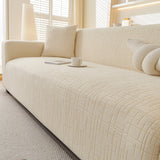 Cream Beige Quilted Waffle sofa cover draped over a three-seater sofa in a bright living room