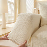 Cream Beige Quilted Waffle sofa cover styled with cushions on a low-back sofa
