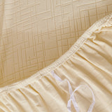 Cream Beige Quilted Waffle sofa cover, surface detail at close range