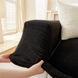 Ink Black Quilted Waffle sofa cover styled with cushions on a low-back sofa, view 4