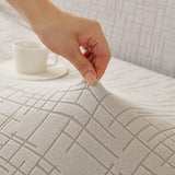 Pearl Grey Quilted Waffle sofa cover shown across the seat and backrest of a two-seater, view 3