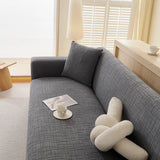 Stone Grey Quilted Waffle sofa cover seen from the side on a corner sofa, view 6