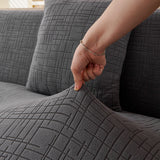Stone Grey Quilted Waffle sofa cover shown across the seat and backrest of a two-seater, view 6