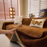 Coffee Brown Corduroy sofa throw shown across the seat and backrest of a two-seater, view 2