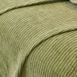 Sage Mist Corduroy sofa throw seen from the side on a corner sofa, view 3