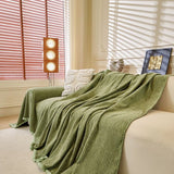 Sage Mist Corduroy sofa throw shown across the seat and backrest of a two-seater, view 3