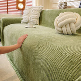 Sage Mist Corduroy sofa throw spread across a sofa in daylight