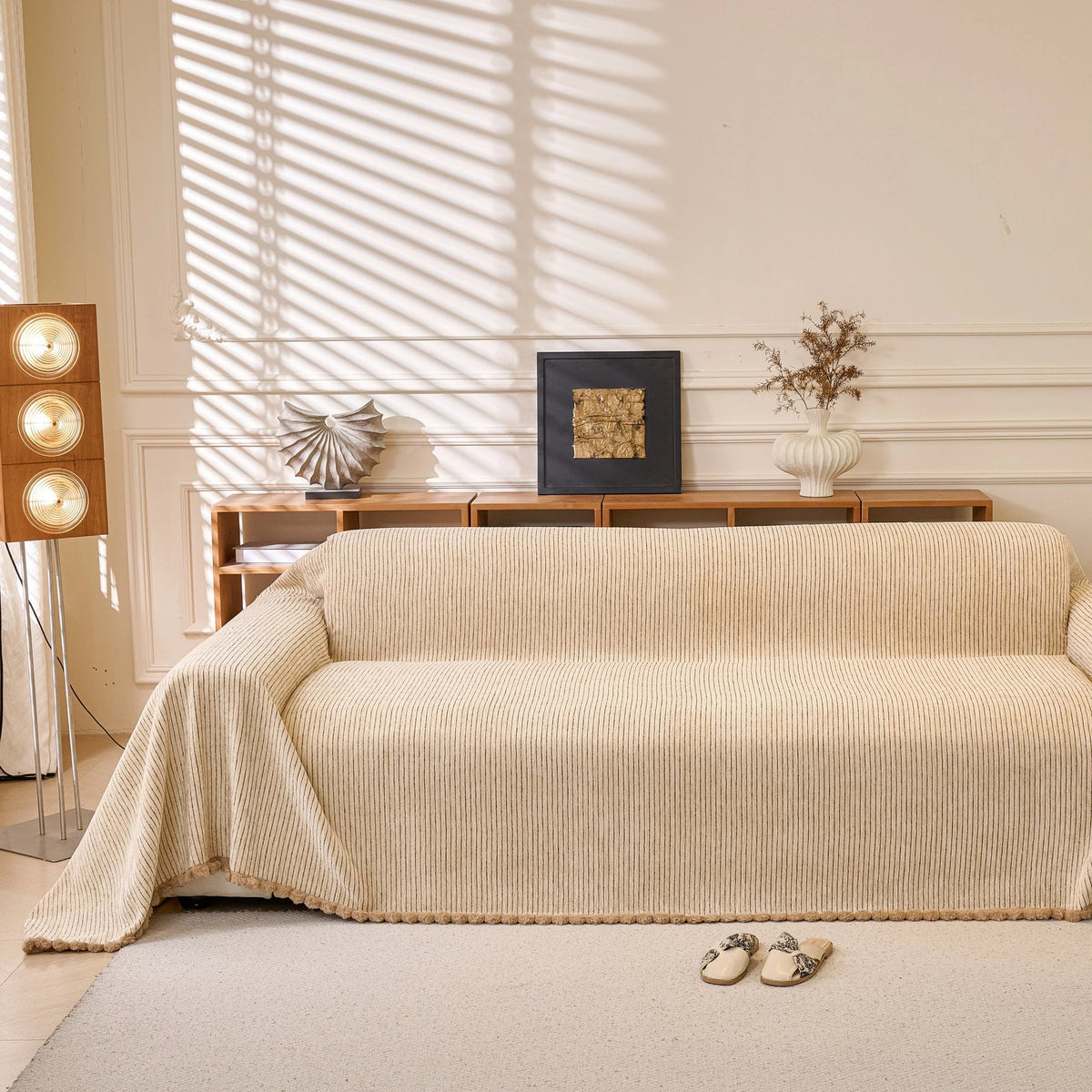 Khaki Corduroy sofa throw draped over a three-seater sofa in a bright living room, view 4