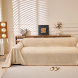Khaki Corduroy sofa throw draped over a three-seater sofa in a bright living room, view 4