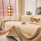 Khaki Corduroy sofa throw seen from the side on a corner sofa, view 4