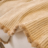 Khaki Corduroy sofa throw shown across the seat and backrest of a two-seater, view 4