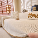 Oat Beige Corduroy sofa throw seen from the side on a corner sofa
