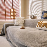 Stone Grey Corduroy sofa throw seen from the side on a corner sofa, view 5