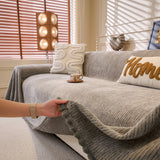 Stone Grey Corduroy sofa throw shown across the seat and backrest of a two-seater, view 5