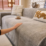 Stone Grey Corduroy sofa throw photographed at an angle beside a floor lamp, view 3