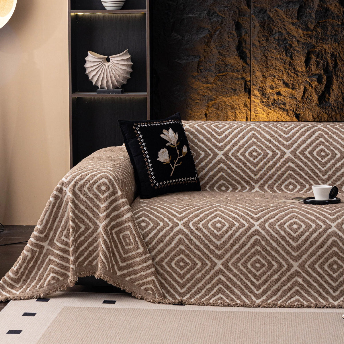 Warm Stone Geometric Boho sofa throw draped over a three-seater sofa in a bright living room, view 5
