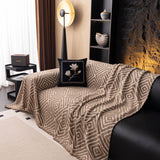 Warm Stone Geometric Boho sofa throw covering the arm and seat of a sectional, view 5