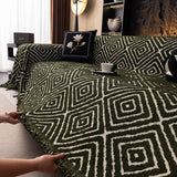 Forest Green Geometric Boho sofa throw seen from the side on a corner sofa, view 4