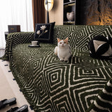 Forest Green Geometric Boho sofa throw styled with cushions on a low-back sofa, view 4