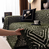 Forest Green Geometric Boho sofa throw covering the arm and seat of a sectional, view 4