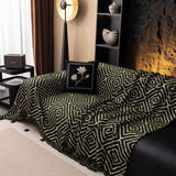 Forest Green Geometric Boho sofa throw spread across a sofa in daylight, view 4