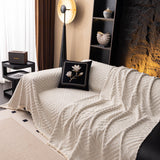 Ivory Cream Geometric Boho sofa throw photographed at an angle beside a floor lamp, view 3