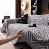 Pearl Grey Geometric Boho sofa throw styled with cushions on a low-back sofa