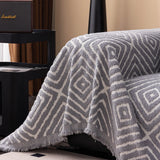Pearl Grey Geometric Boho sofa throw seen from above across the seat