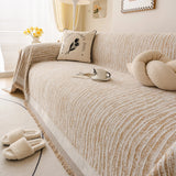 Caramel Linen Knit sofa throw shown across the seat and backrest of a two-seater, view 2