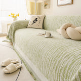 Forest Green Linen Knit sofa throw seen from the side on a corner sofa, view 3