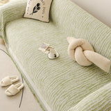 Forest Green Linen Knit sofa throw shown across the seat and backrest of a two-seater, view 3
