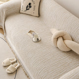 Khaki Linen Knit sofa throw shown across the seat and backrest of a two-seater, view 4