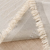Oat Beige Linen Knit sofa throw styled with cushions on a low-back sofa