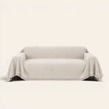 Oat Beige Linen Knit sofa throw on a plain studio background